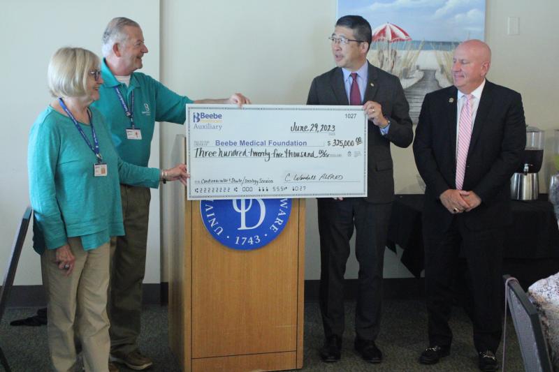 Beebe Auxiliary wrote a check to the Beebe Medical Foundation for $325,000. It is the single largest donation the volunteer organization has ever given to Beebe. Shown are (l-r) Beebe Auxiliary Treasurer Nancy Tartaglione, Beebe Auxiliary President C. Wendell Alfred, Beebe Healthcare President and CEO Dr. David Tam, and Beebe Medical Foundation President Tom Protack. AARON MUSHRUSH PHOTOS