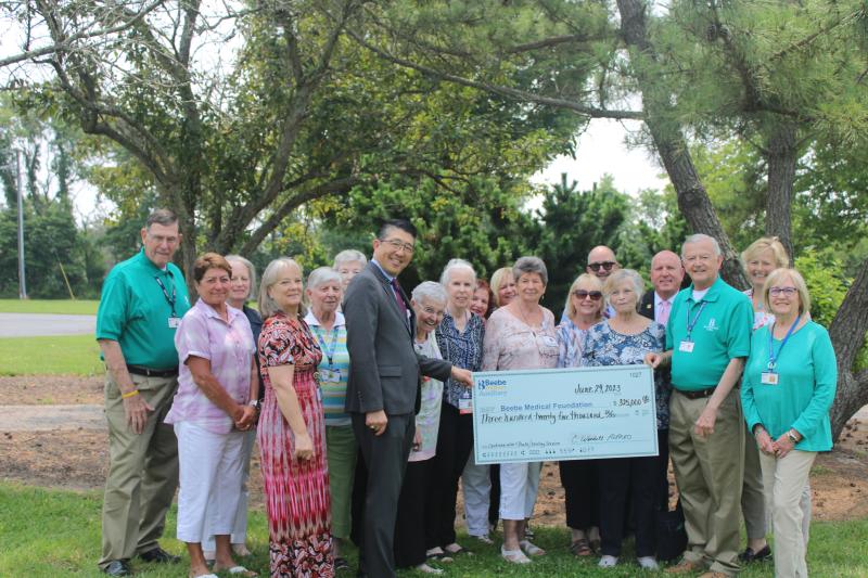 Beebe Auxiliary was founded in 1936 for the sole purpose of promoting Beebe Healthcare and its patients. The $325,000 donation adds to the more than $3 million the organization has donated to the healthcare system. Shown in back are (l-r) Mike Clemmer, Gail Altenburger, Nancy Almacy, Paula Costanzo, Leslie Nance, Rick Schaffner, Tom Protack, and Kay Young. In front are Donna Schifflett, Lee Hollaran, Jery Kaplan, Dr. David Tam, Muriel Pfeiffer, Linda Roll, Eileen Thompson, Rosey Vanderghoot, Ro Phillips, C. Wendell Alfred and Nancy Tartaglione.