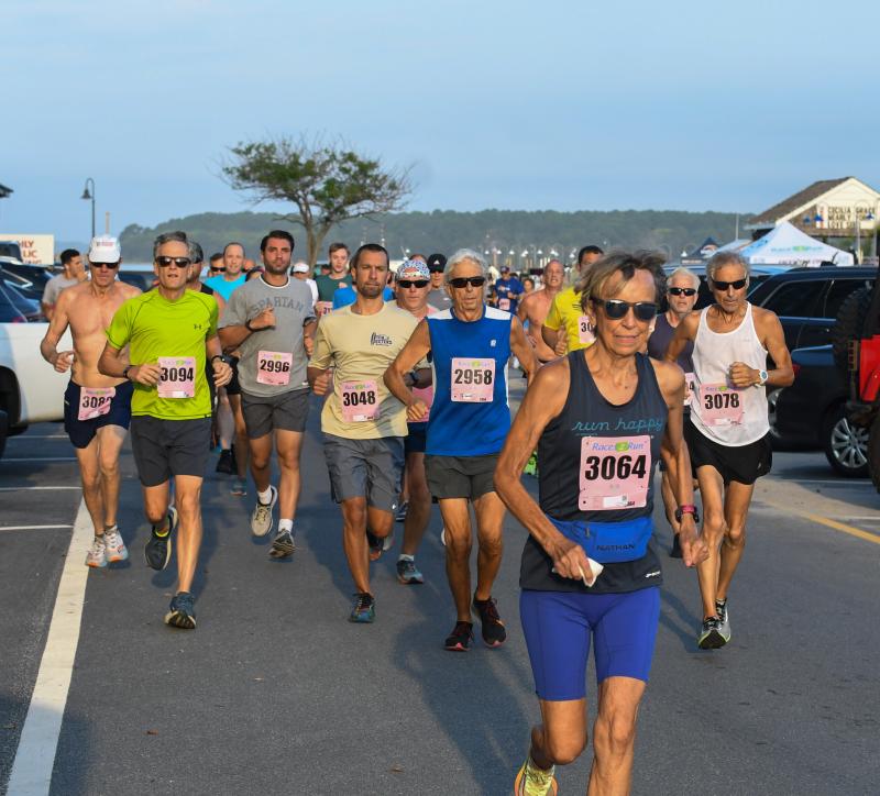 Mary Kessler leads a following sea of male runners. DAVE FREDERICK PHOTO