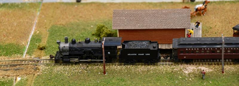 Paul Lovett’s N-gauge train makes a stop on the tracks at the freight depot.