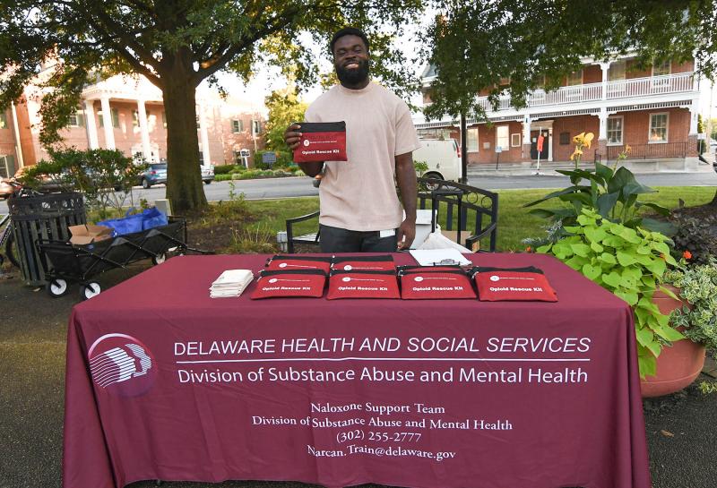 Amos Quoi of Delaware Health and Social Services gives out opioid rescue kits.