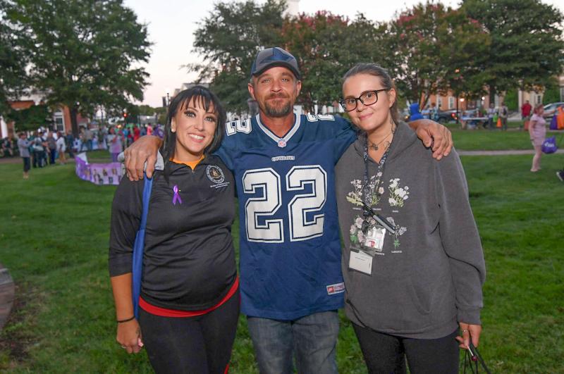 A recovering James White, center gets a hug from Ashley Stephens, left, and Rose Grier from Banyon Treatment Center.