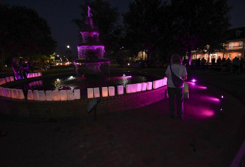 The paper bag luminaries light up the fountain on the Circle in Georgetown.