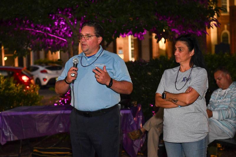 AtTAcK Addiction board member Karl Fischer speaks to the crowd gathered at the event.