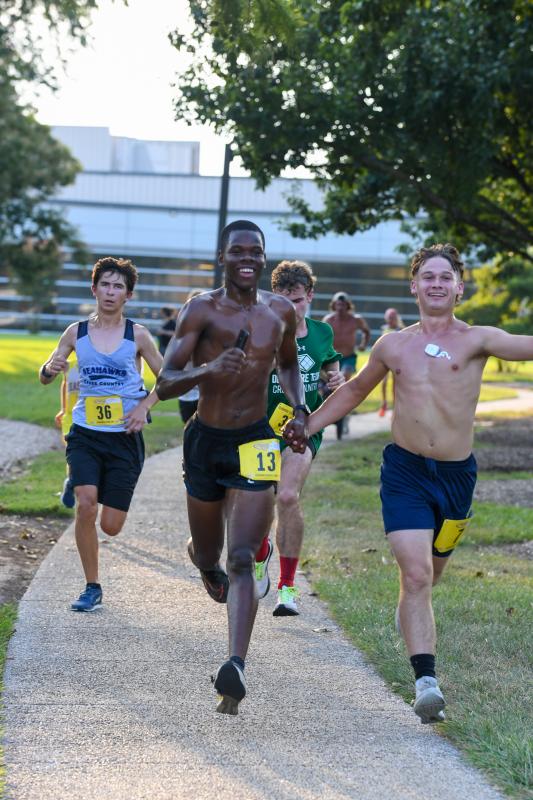 Josue Laurore leads a pack of young gun runners.