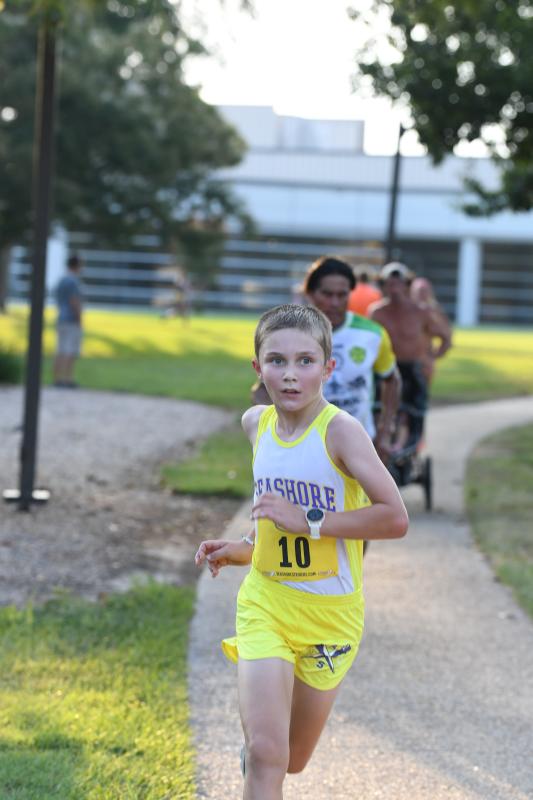 Nolan Furlong, 10, runs to a time of 21:36.