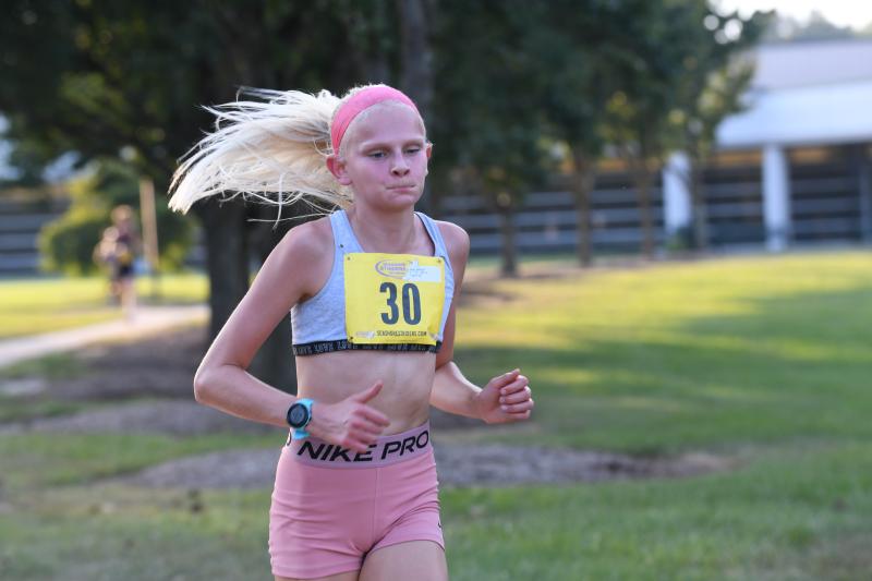 Paige Ballinger, 13, wins the overall female title in 21:42.