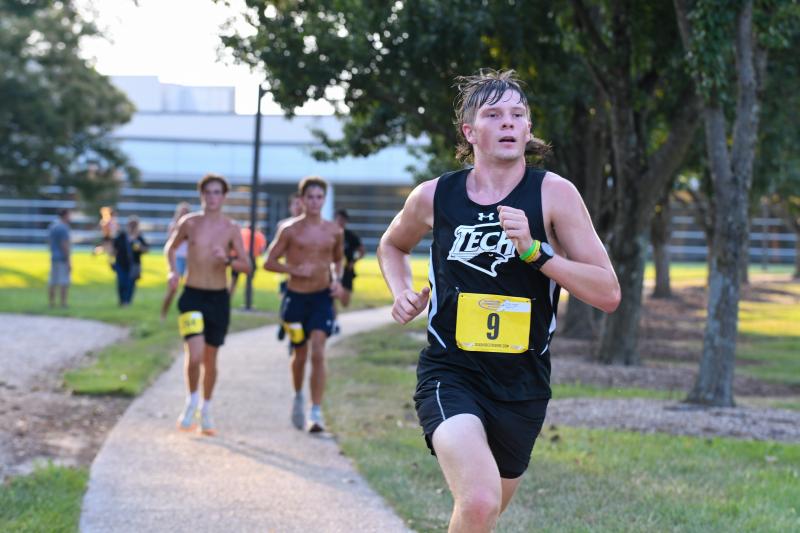 Bennett Brumbley crosses the finish line in 23:05.