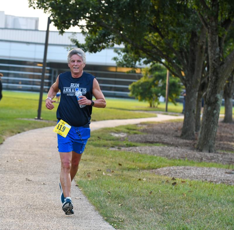 Delaware Tech President Mark Brainard runs to a time of 29:29.