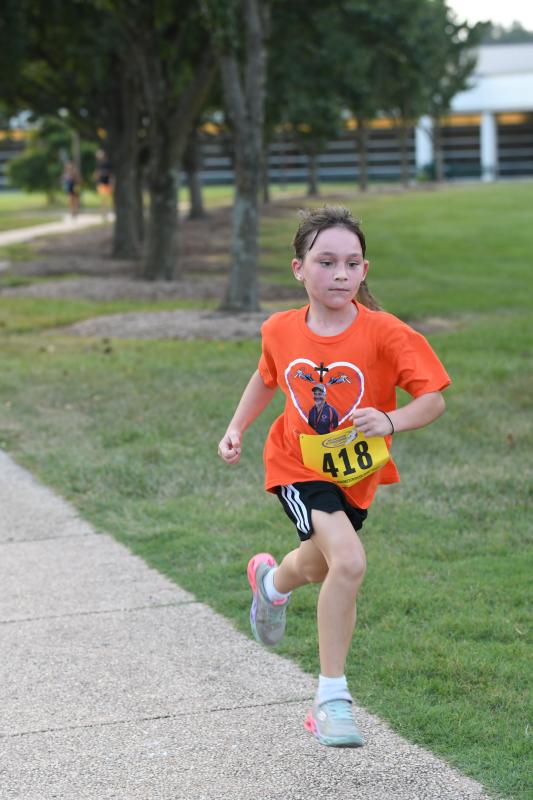 Nora Ballard, 7, registers a time of 32:14.