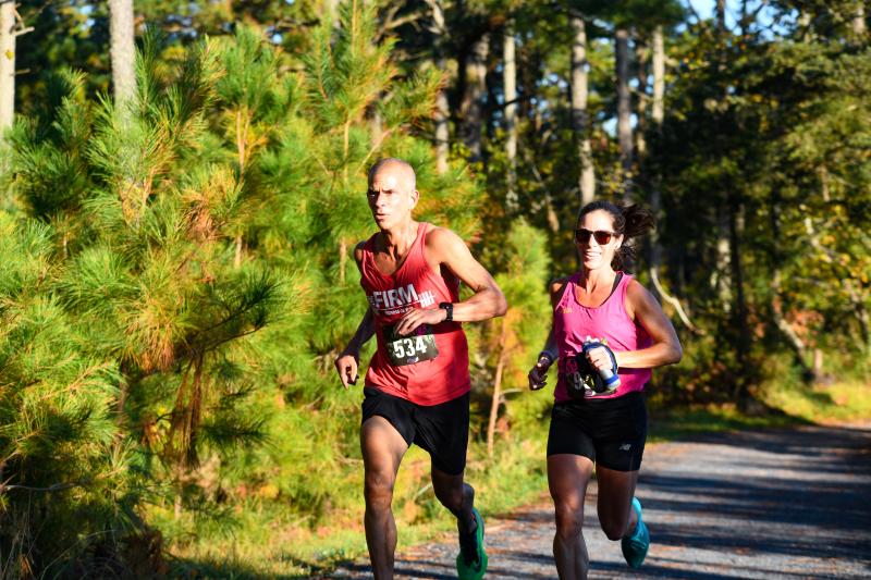 Paul Timmons and Sarah Richards arrive at the six-mile mark. They ran the half-marathon together in 1:37.