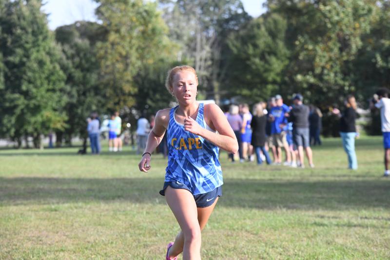 Allaire Burton heads across the finish in 21:34.