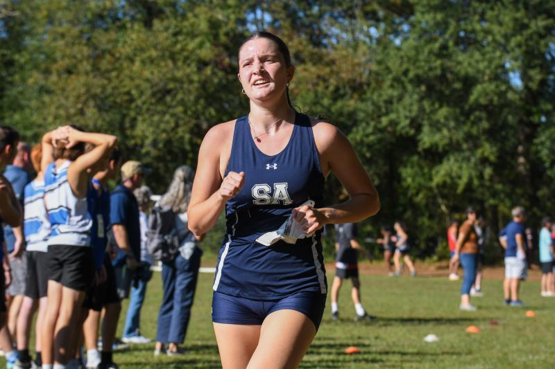 Lily Bowe of Sussex Academy completes the course in 21:39.