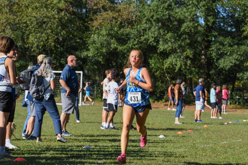 Allaire Burton of Cape crosses the finish in 21:53.