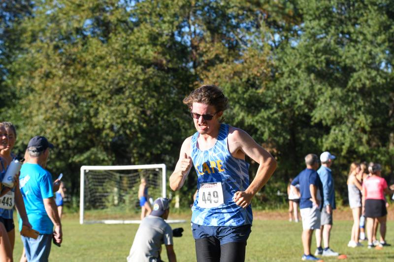 Cape’s Max Gillen hustles across the finish line in 17:34.