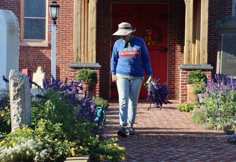 Helen Waite walks down the path from the main entrance of St. Peter’s.