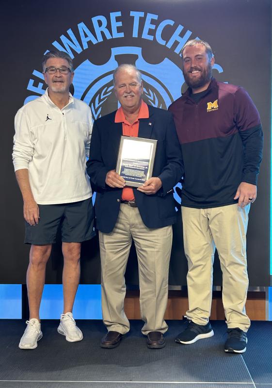Buddy Hitchens, center, with presenter Jerry Kobasa and Jed Bell, president of the Delaware Association of Athletic Directors.