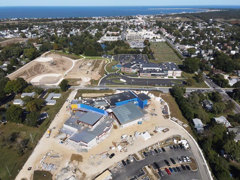 Beyond Frederick D. Thomas Middle School under construction in the foreground are Lewes Elementary, Bethel Methodist Cemetery and Beebe Healthcare on Savannah Road to the right. Left, athletic fields are being prepared. The City of Lewes, Delaware Bay and The Point are visible in the background. NICK ROTH PHOTO