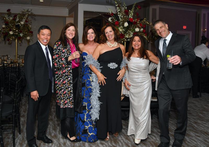 Enjoying the cocktail hour are (l-r) Dr. Delbert Kwan and his wife Lisa, Kelli Meoli, Marcy Saliba, and Hiba and Dr. Erik Stancofski.