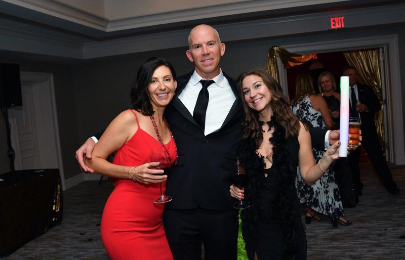 Enjoying the after-dinner party are (l-r) Dr. Katie Miller with her husband Tim and Juliet Shalon.