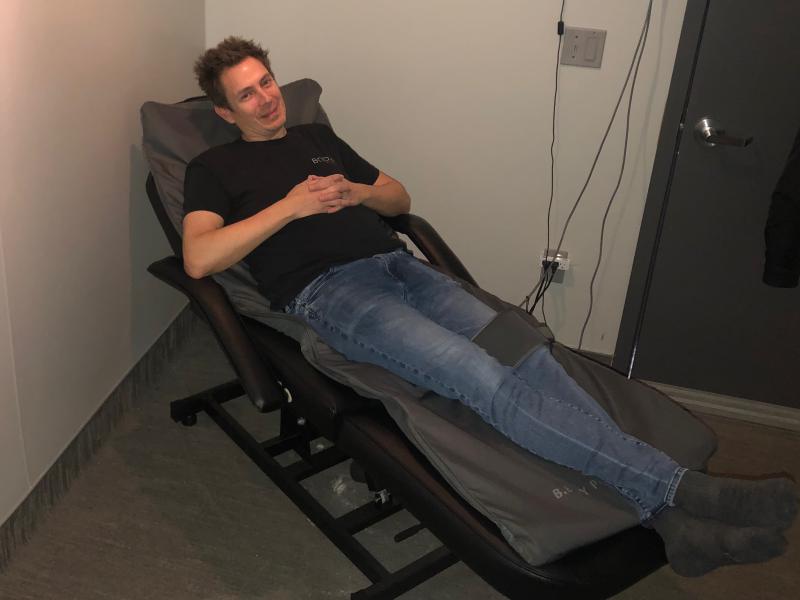 Ben Winiarczyk sits on the BEMER before his bartending shift to increase energy levels, decrease muscle pain and improve immune function. SUBMITTED PHOTO
