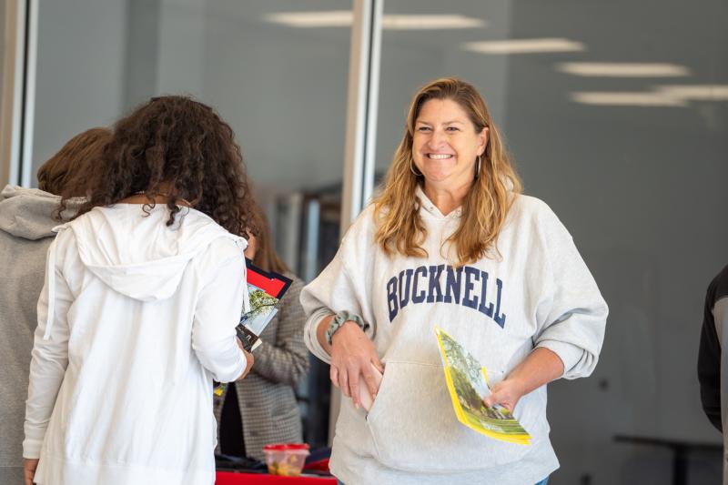 DCHS Counselor Terri Smith welcomes students to the Arts and Athletic Center for College Week sessions.