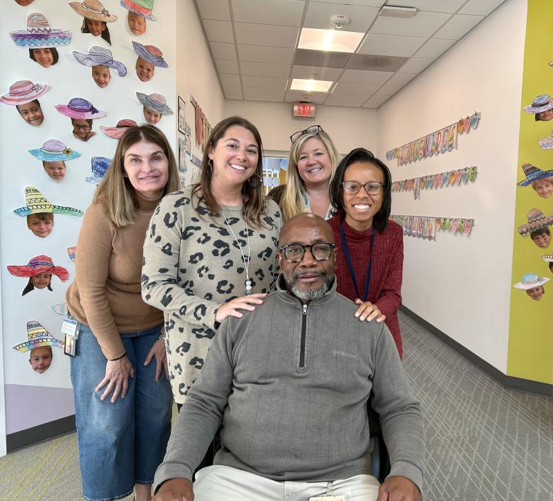 Cape Henlopen School District Educational Support Person of the Year and Rehoboth Elementary paraeducator Gilbert Maull, center, is surrounded by first-grade teachers (l-r) Dawn Dorman, Mary Jones, Melissa Dawson and Portia Craig. ELLEN DRISCOLL PHOTO