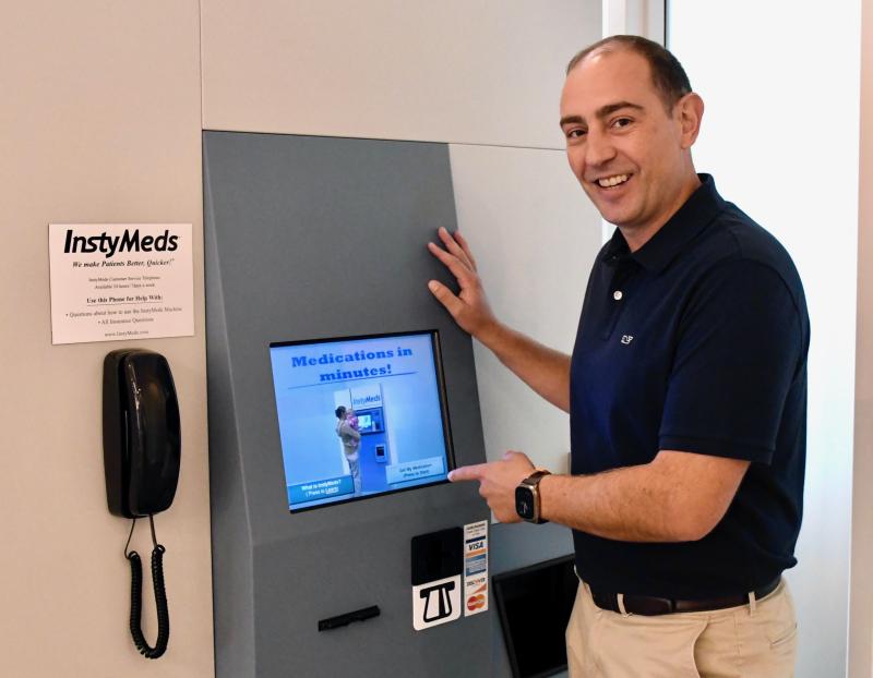 Atracare CEO Will Albanese points to the first-of-its-kind vending machine prescription dispenser in Delaware. RON MACARTHUR PHOTOS