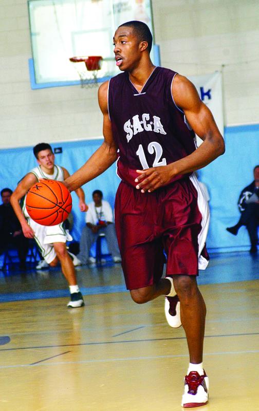 Dwight Howard brings the ball up court during the 2003 Slam Dunk to the Beach event at the old Cape Henlopen High School.