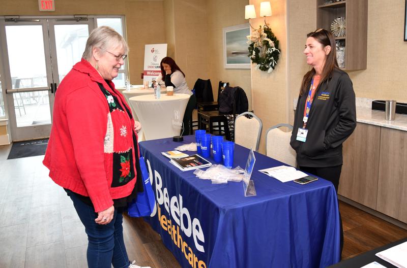 Dorie Nichols, left, of Millsboro gleans information from Beebe Healthcare Marketing Communications Coordinator Mary Green.