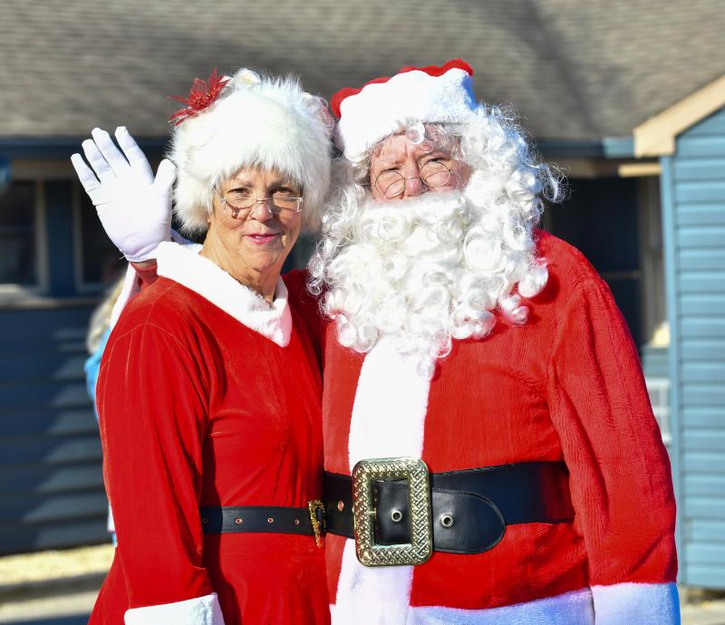 Santa thinks about doing the rabbit ears, but settles for a wave instead.