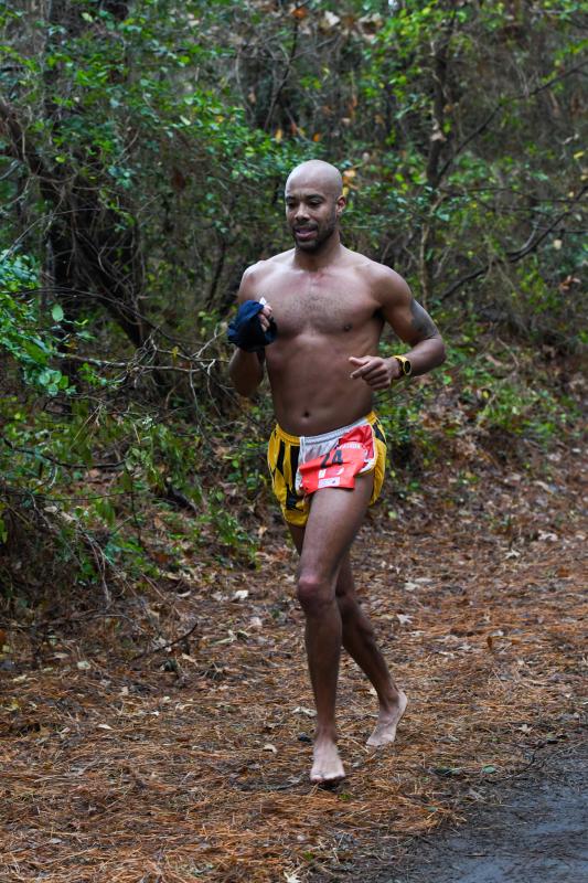 Aaron Anderson, 40, ran shirtless, shoeless and sockless to a time of 2:56 in the marathon.