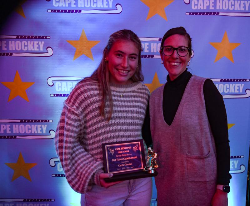 Carrie Clausius, left, is given the One Tough Cookie Award by coach Kate Austin. DAVE FREDERICK PHOTOS