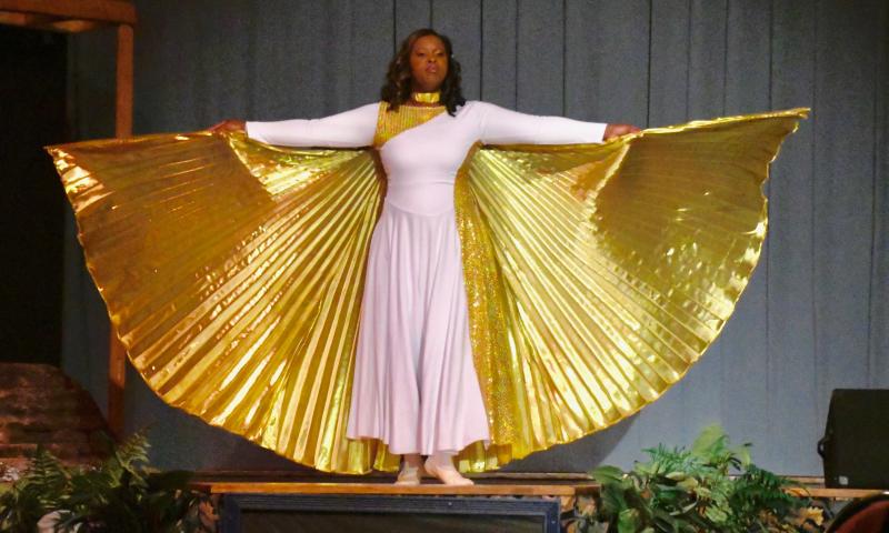 Dancer Kayla Hamon displays an eye-catching dress as she portrays an angel during the Nativity presentation at the Trinity Faith Christian Center Christmas celebration Dec. 16 at the Lewes church. RON MACARTHUR PHOTOS