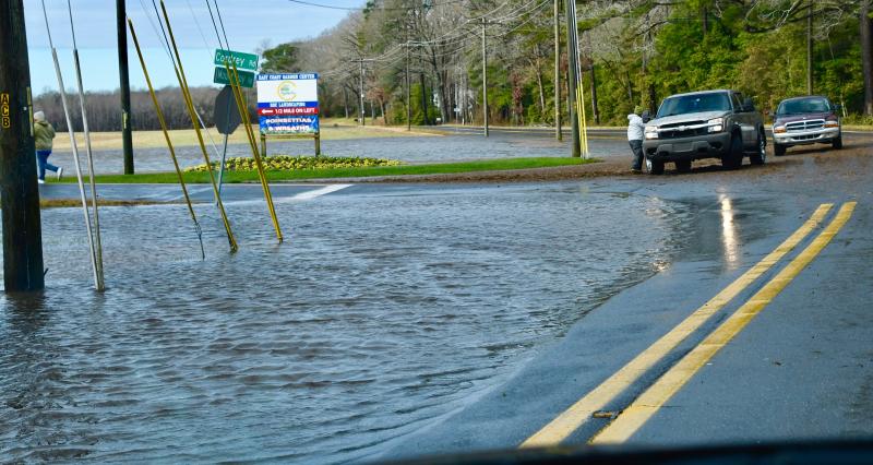 There is just enough room to get onto Cordrey Road near Long Neck. Cannon Road, shown, was closed to traffic because of a washout. RON MACARTHUR PHOTO