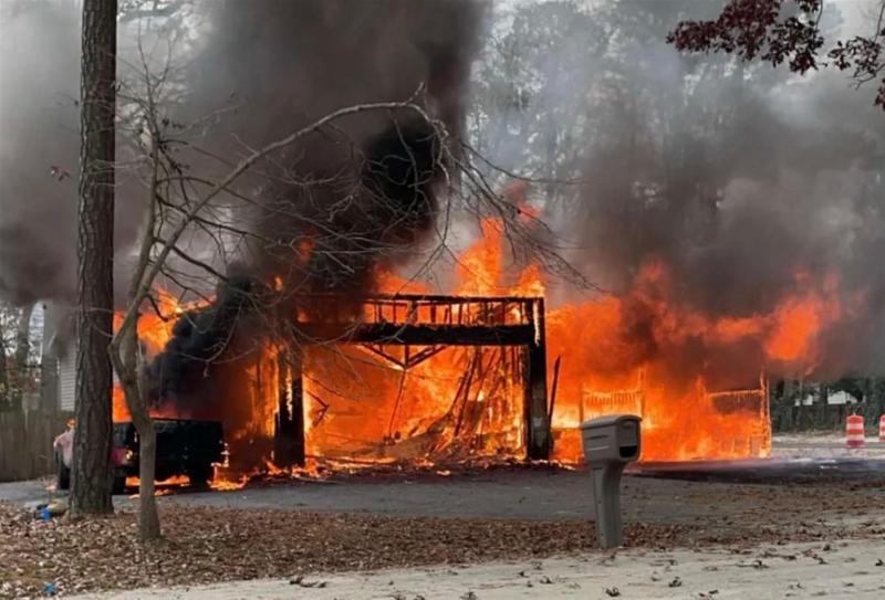 A fire burns a home in Long Neck Dec. 1. INDIAN RIVER VOLUNTEER FIRE CO. PHOTOS