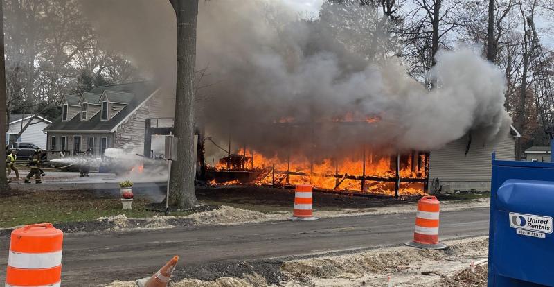 The fire was reported about 11 a.m. in the Sherwood Forest North neighborhood.