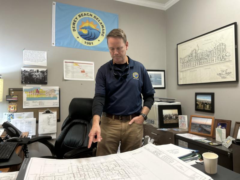 Dewey Beach Town Manager Bill Zolper reviews schematics for the new town hall and police department. More than 60% of the design work is completed, Zolper said, with groundbreaking set to occur in the fall. ELLEN DRISCOLL PHOTO