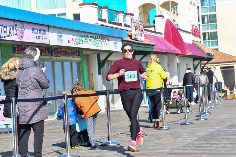 Melissa Wiley wins the women’s race at the Run to the Plunge 5K.