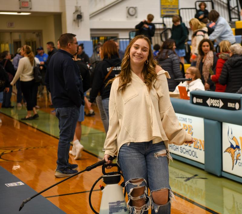 Madison Elphick disinfects the mat.