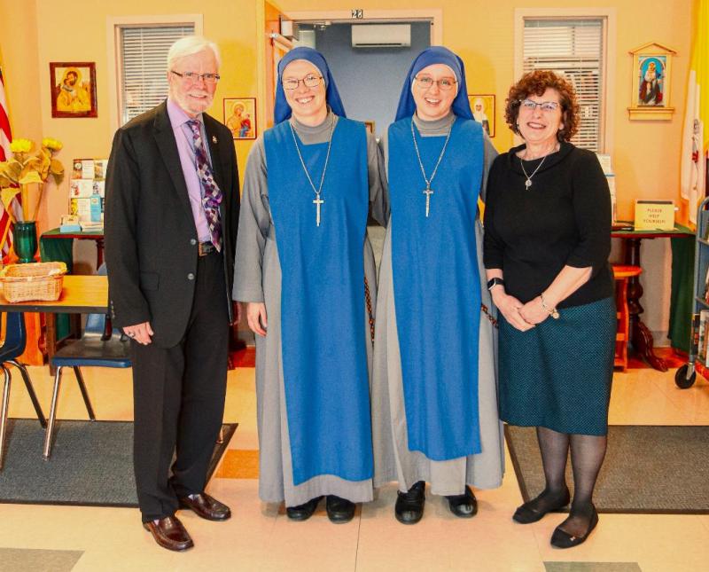 St. Jude the Apostle religious education students learned about religious vocations from two nuns who recently visited. Shown are (l-r) Michael McShane, Christian Formation director; Sister Refuge of Sinners; Sister Light of Confessors; and Donna Cofalka, Christian Formation assistant director.