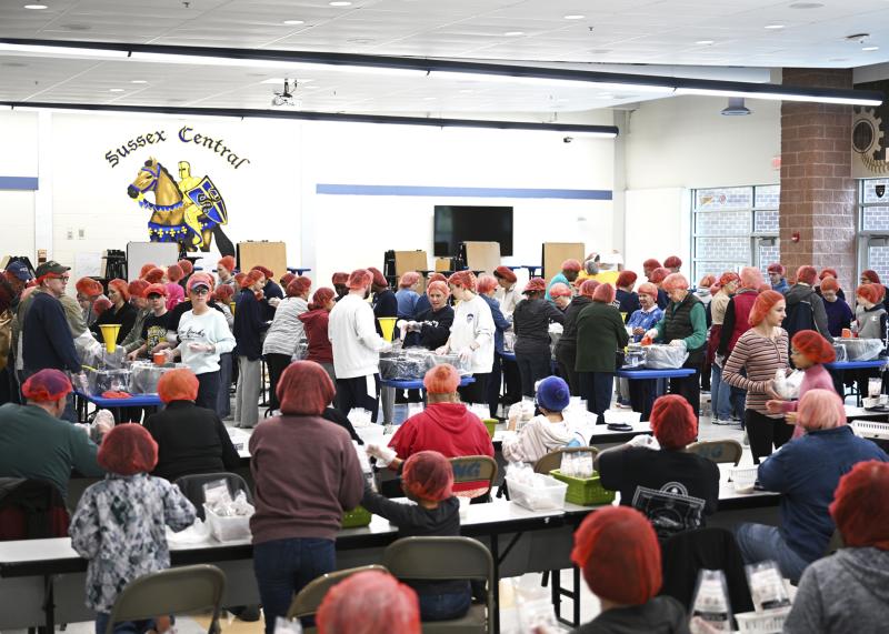 High-tempo music filled the cafeteria while the high-energy crowd got to work.