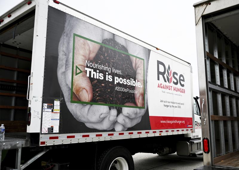 A pair of box trucks were used to transport the food packs.