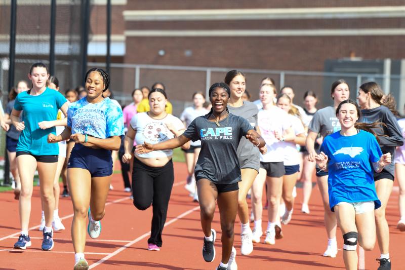 Track girls do striders on the straightaway.