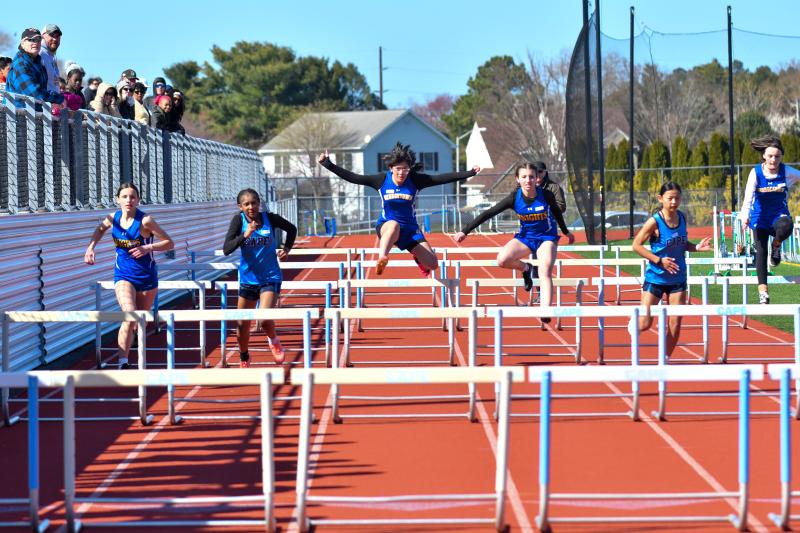The first flight of girls in the 55-meter hurdles.