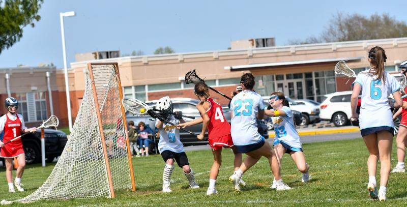 Rani Yonker shoots on sixth-grade goalie Penelope Bohl.