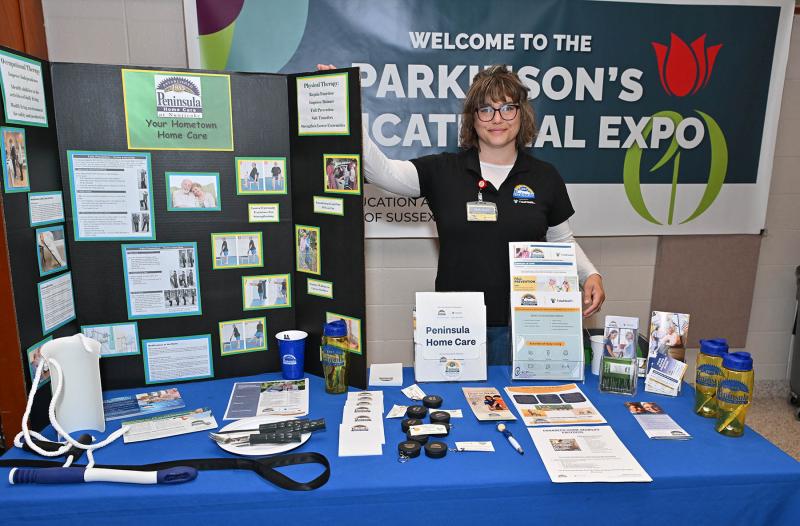 Holly Jones of Peninsula Home Care at Nanticoke stands at the info booth.