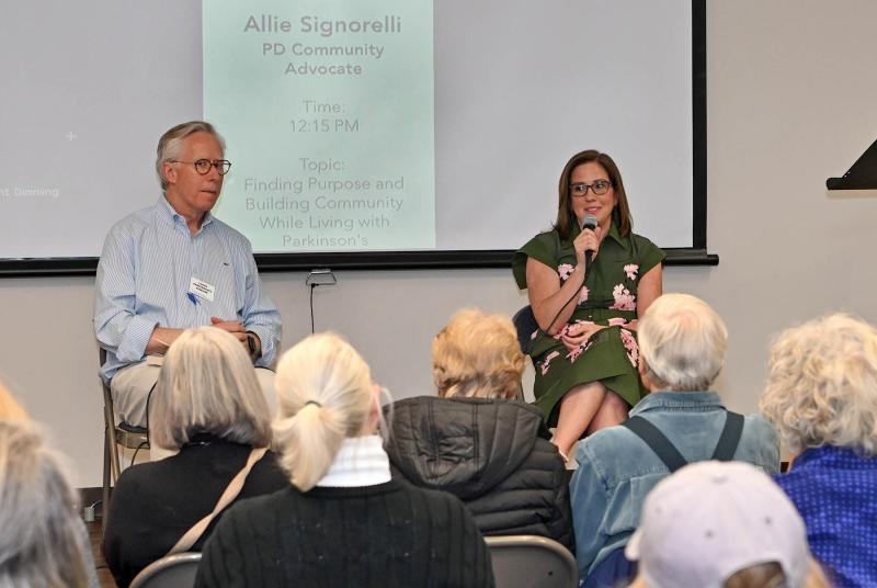 Allie Signorelli, an advocate who was diagnosed with Parkinson’s in 2002 at age 47, speaks to the crowd about finding purpose and building community while living with Parkinson’s.