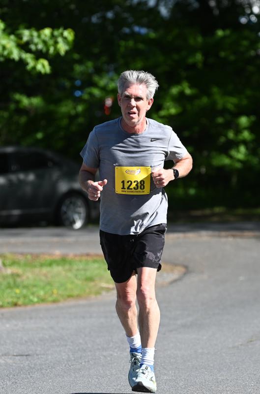 Chris Stanley, 55, of Fruitland, Md., heads to the finish line. He finished with a time of 22:35, good enough for second in his age group.