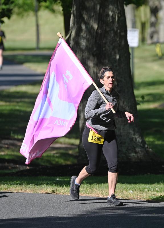 Lorikay Paden, 56, of Lewes carries a YMCA flag.